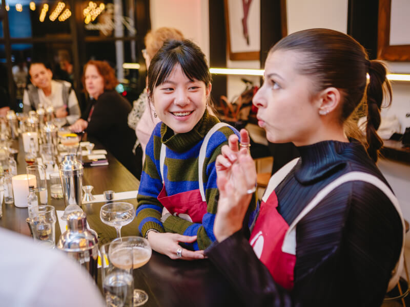 A couple trying drinks together at a cocktail making class.